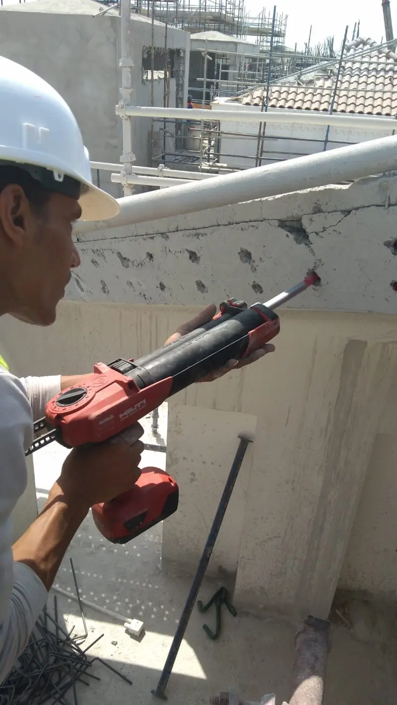 Chemical anchoring work on a concrete column in Qatar